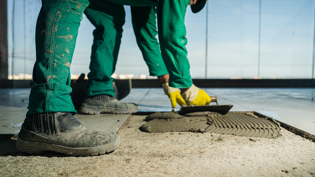 Jackson Concrete Co crew finishing a fresh concrete pour with hand tools in Jackson, TN